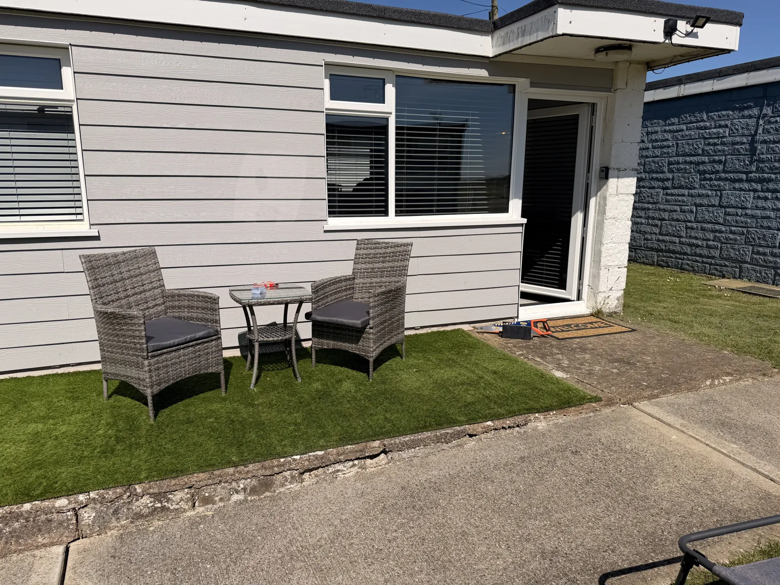 Yaverland Breeze exterior with garden seating on artificial lawn