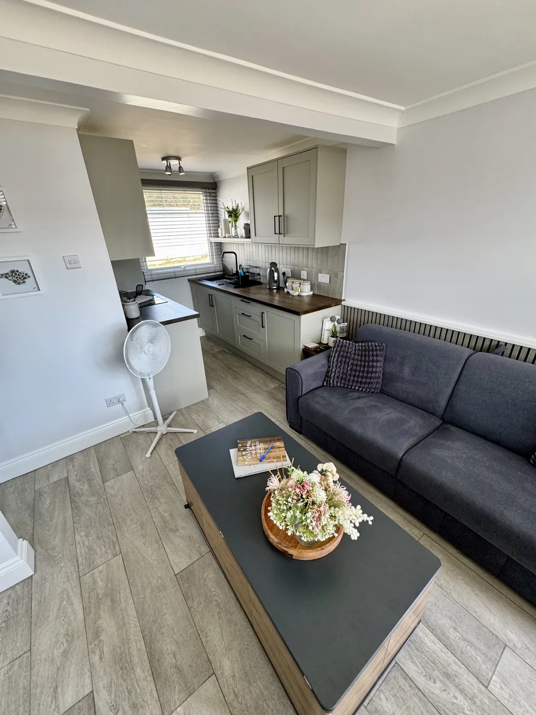 Open-plan living area looking towards the kitchen at Yaverland Breeze