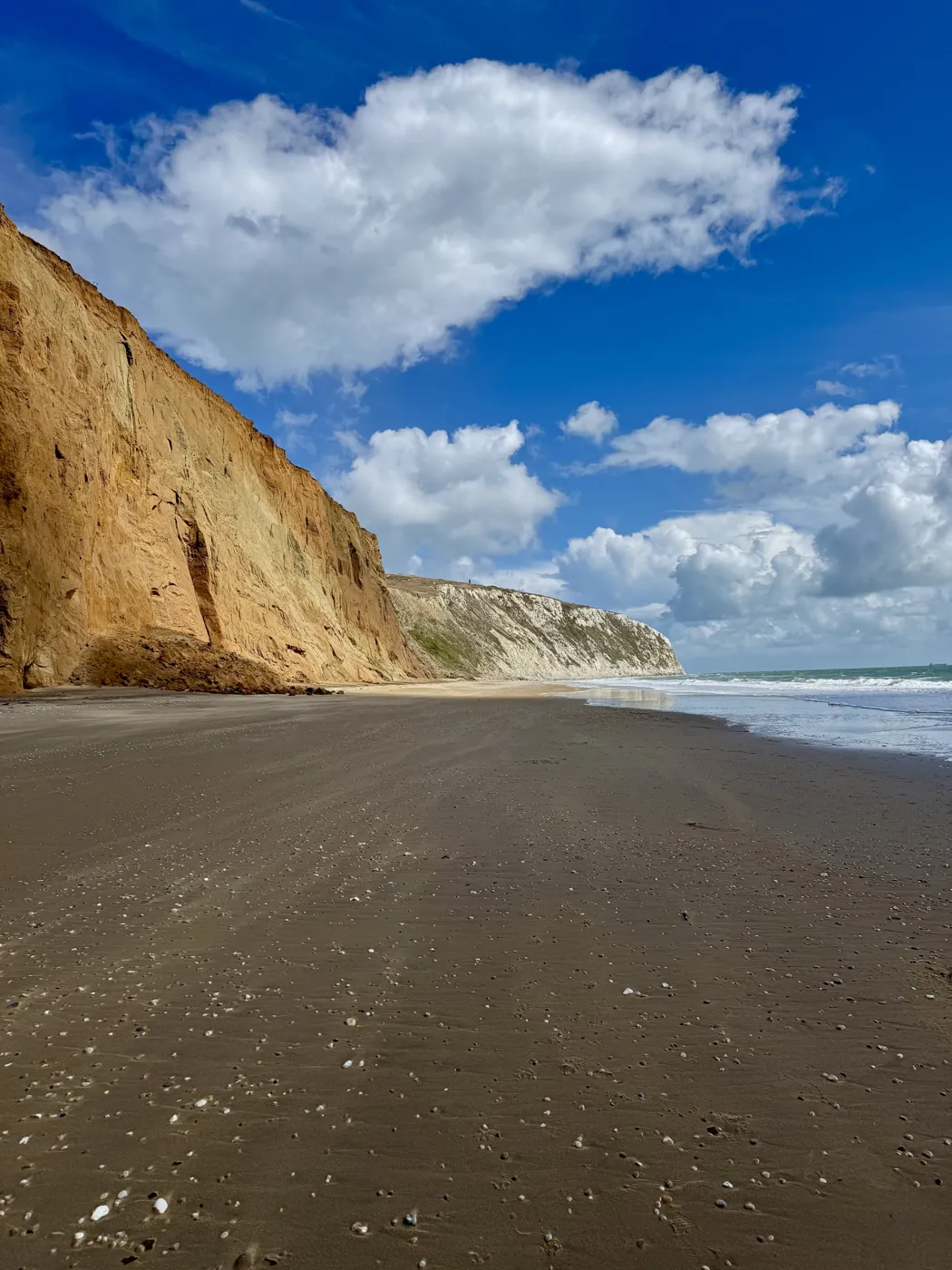 Golden sandstone cliffs beside the beach near Yaverland